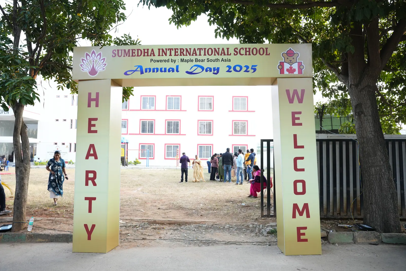 Decorated welcome arch at the entrance to the Annual Day 2025 celebration