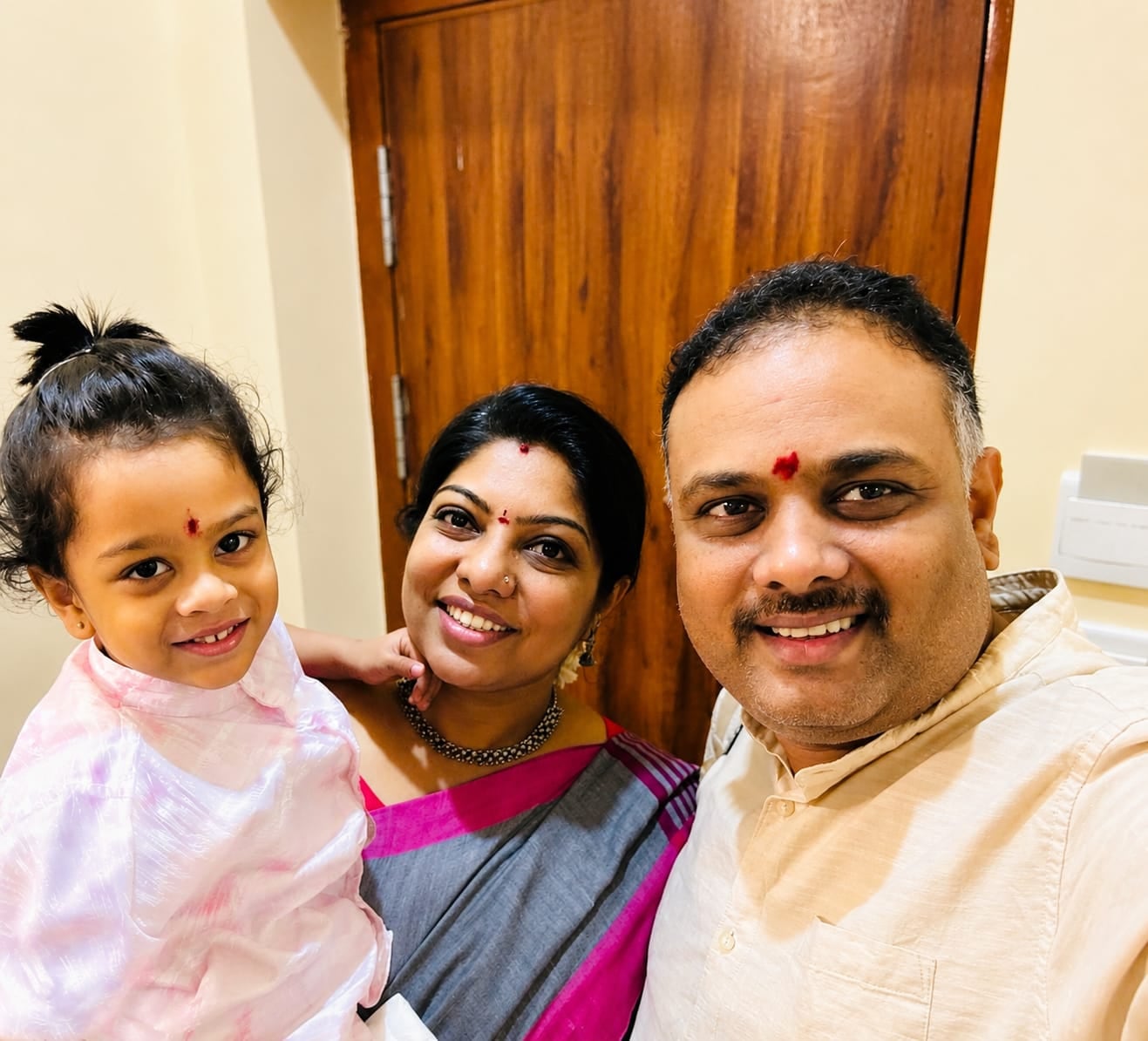 Family portrait of Kautilya S. Raksha with her parents
