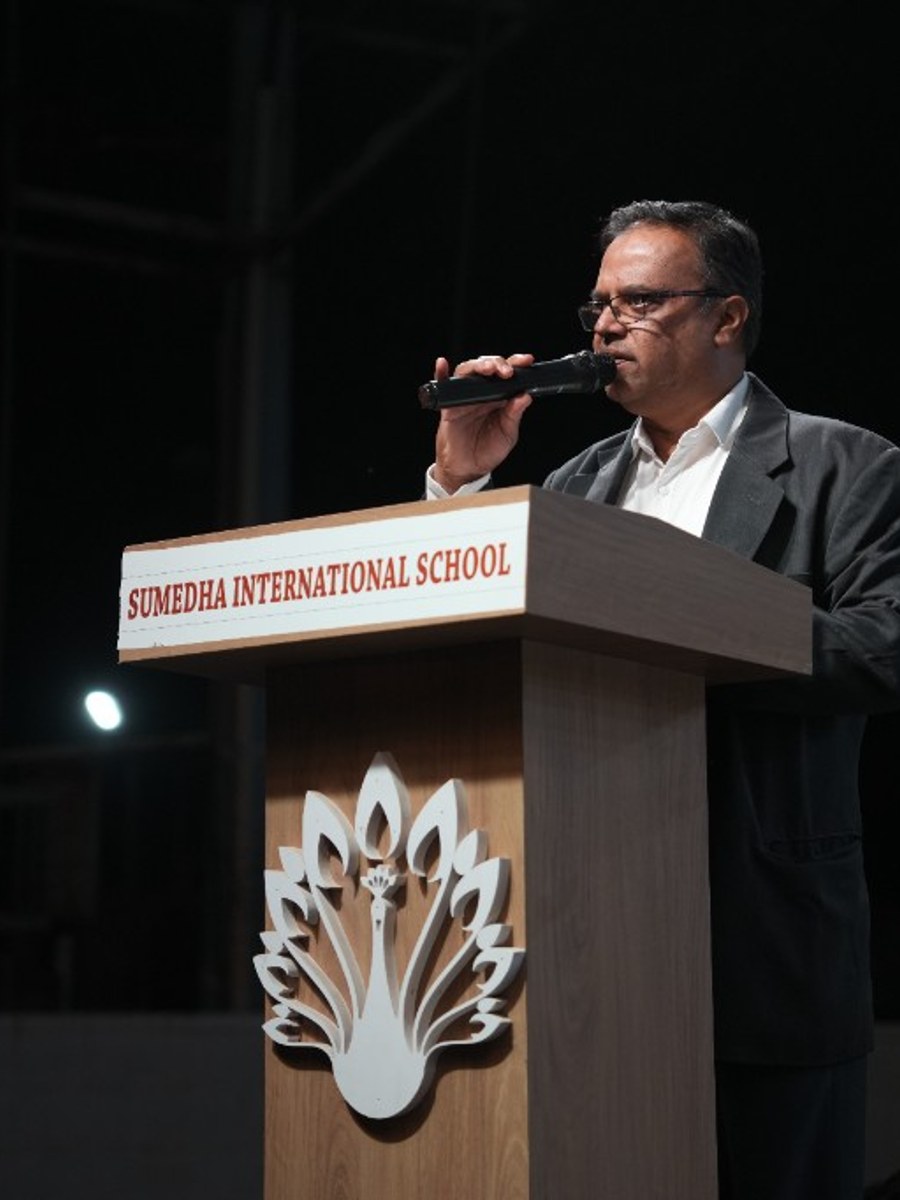 Mr. M. S. Shiva Satish, Principal of Sumedha International School, speaking at the school podium