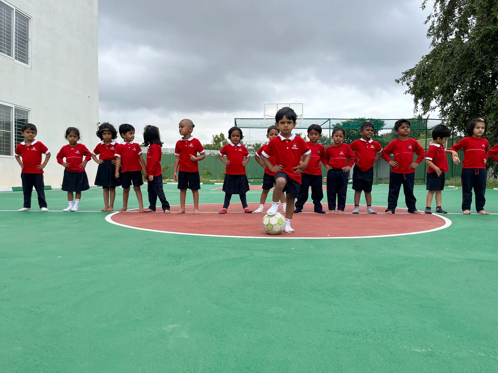 Students gathered in a circle during football training